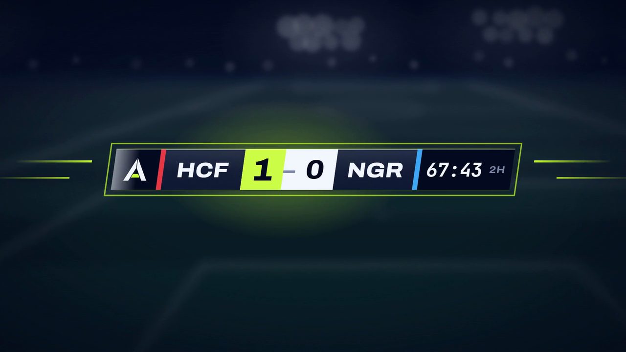 A football scoreboard graphic flipping to 1-0 with a lime flash over a blurred night pitch